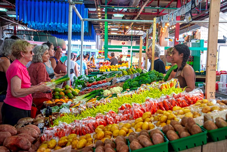 People Buying Vegetables At Bazaar