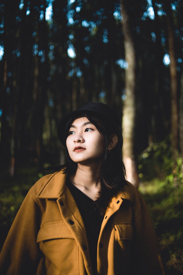 Young Woman In Green Forest