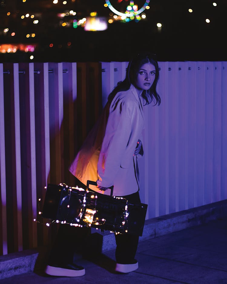 A Woman With A Radio At Night 