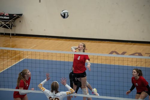 Young Girls Playing in a Volleyball Match 