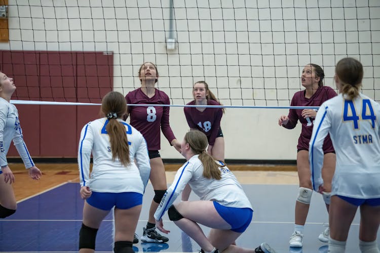 Young Girls Playing In A Volleyball Match 