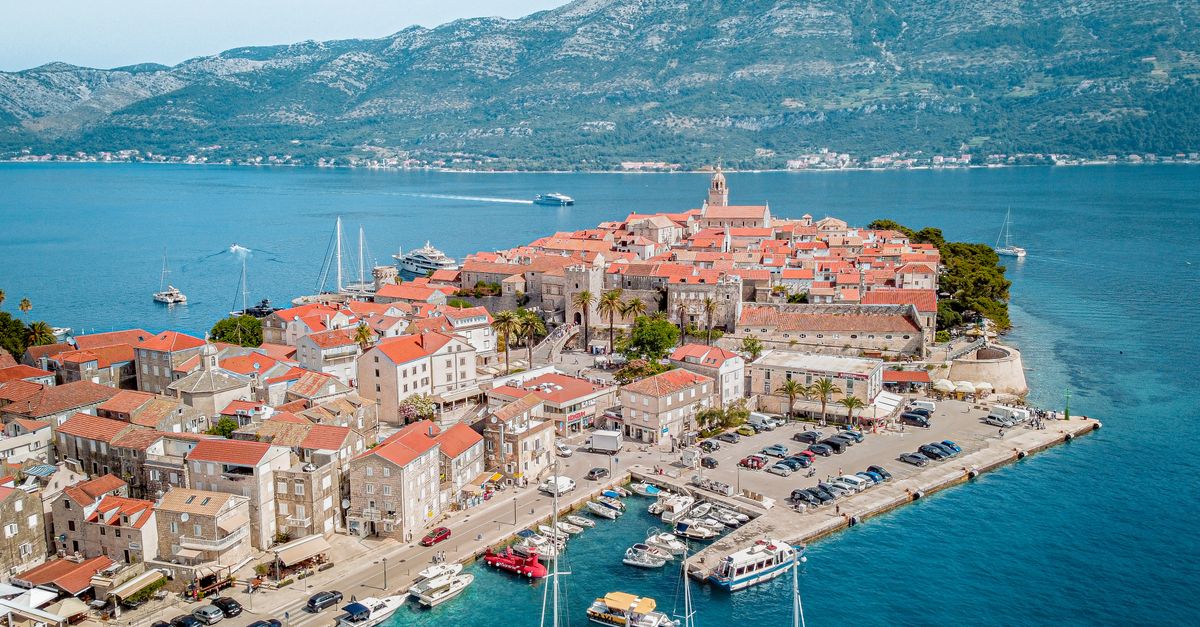 Stunning aerial view of Korcula's old town and marina by the Adriatic Sea.
