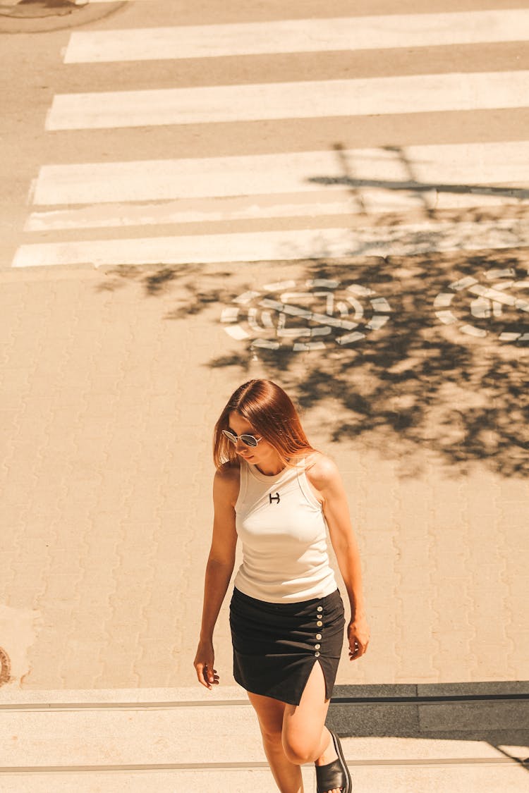 Photo Of A Gir; Walking On A Road In A Summer Light