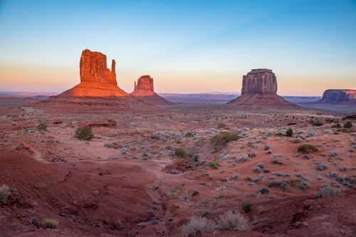 Free Breathtaking view of Monument Valley's iconic rock formations at sunrise, highlighting the stunning desert landscape. Stock Photo