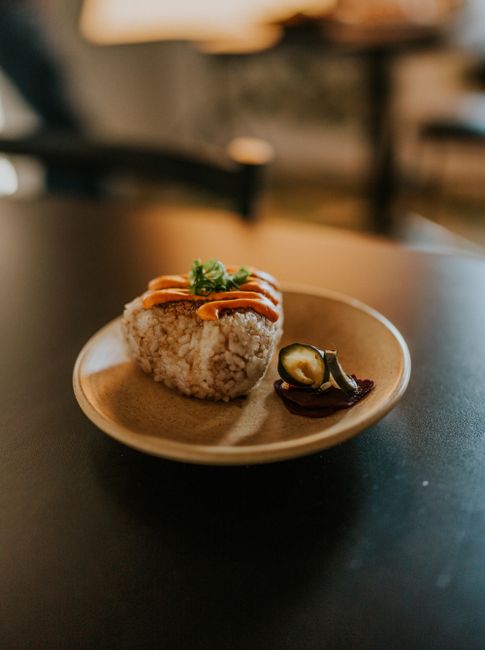 Pan-seared rice balls brushed with soy sauce until the outside turns crisp and toasty.