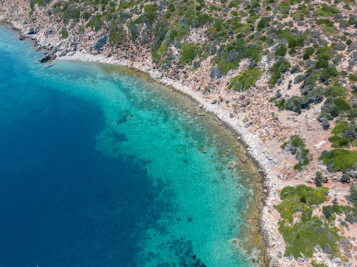 Aerial View of a Coastline with Turquoise Water 