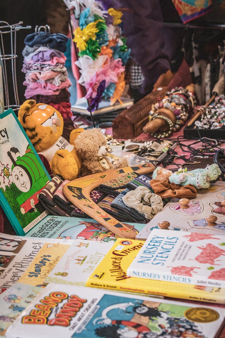 Toys, Books And Jewelry On A Market Stall 