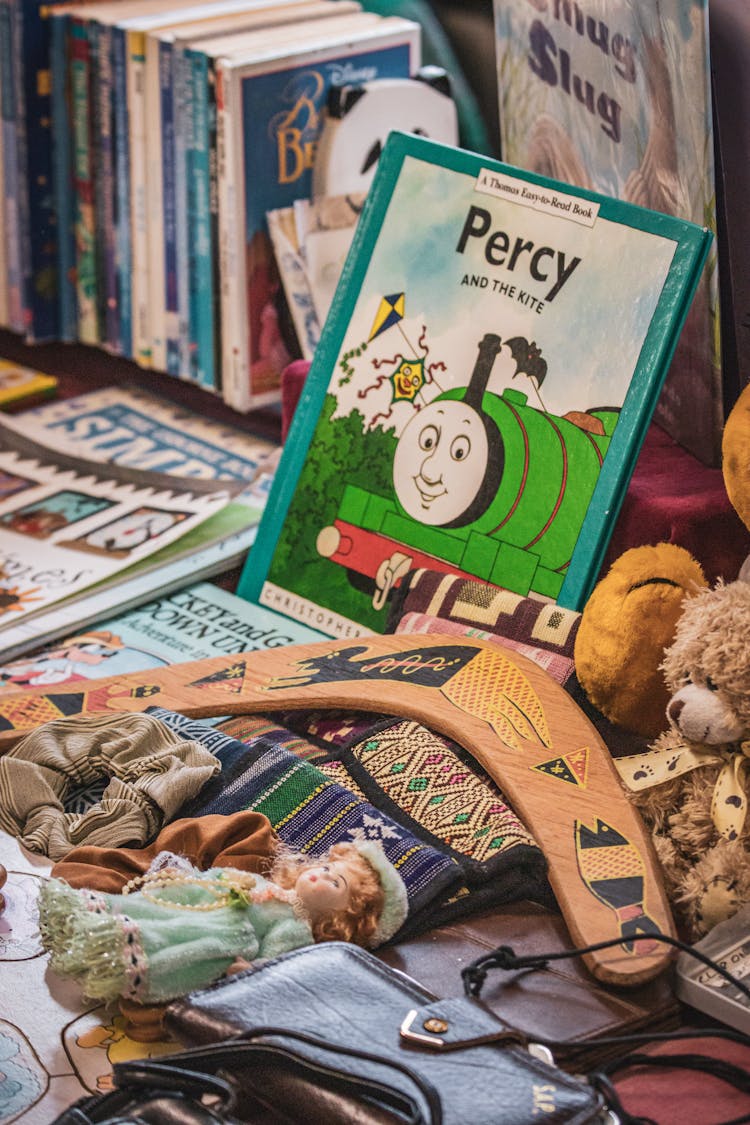 Toys, Books And Jewelry On A Market Stall 