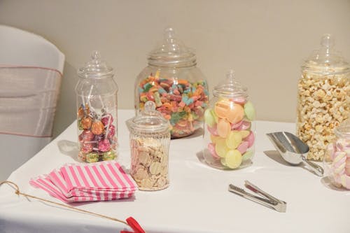 Glass Jars with Sweets on the Table 