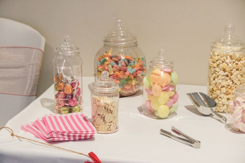 Glass jars filled with sweets on a table