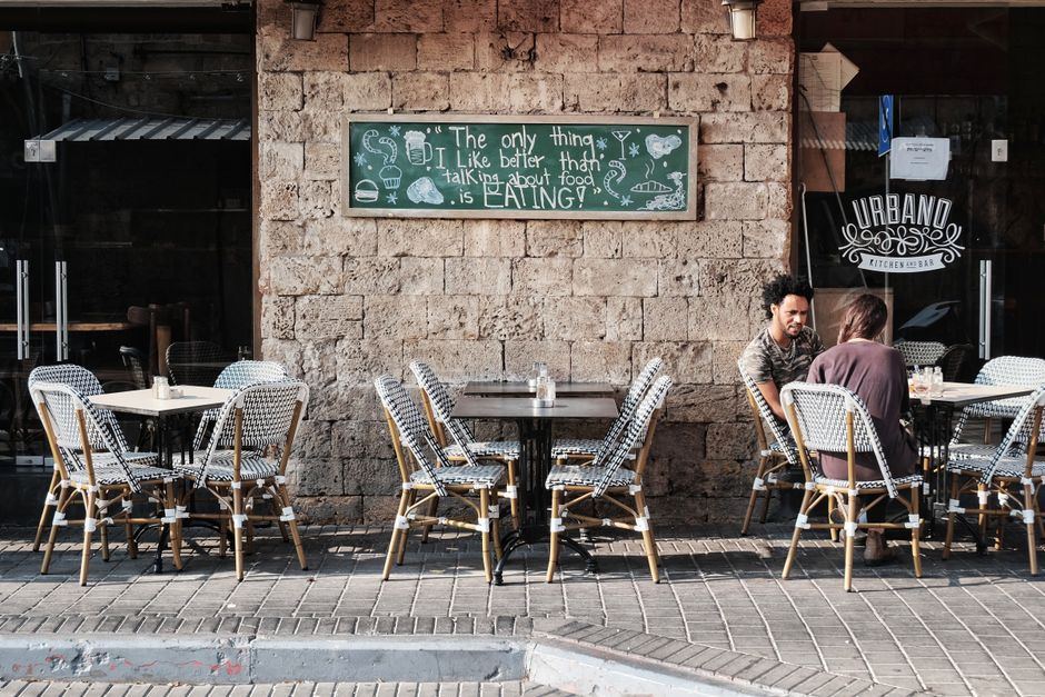 Person using laptop in a cozy cafe in Yerevan, Armenia, with free Wi-Fi