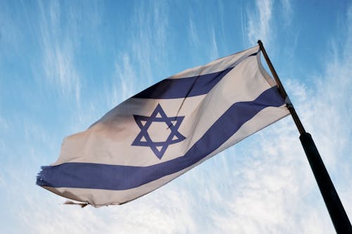 Close-up of the Flag of Israel against Blue Sky 