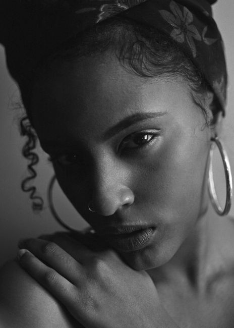 Elegant black and white portrait highlighting feminine beauty and emotion.