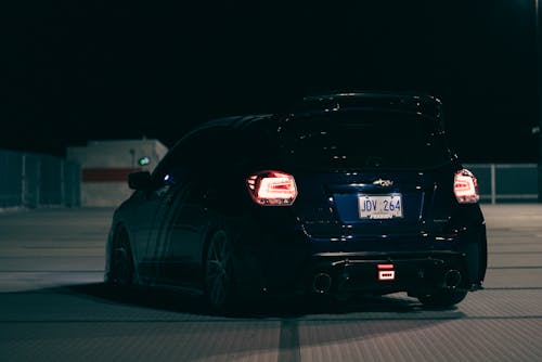 A Modified Subaru WRX on the Parking Lot at Night 