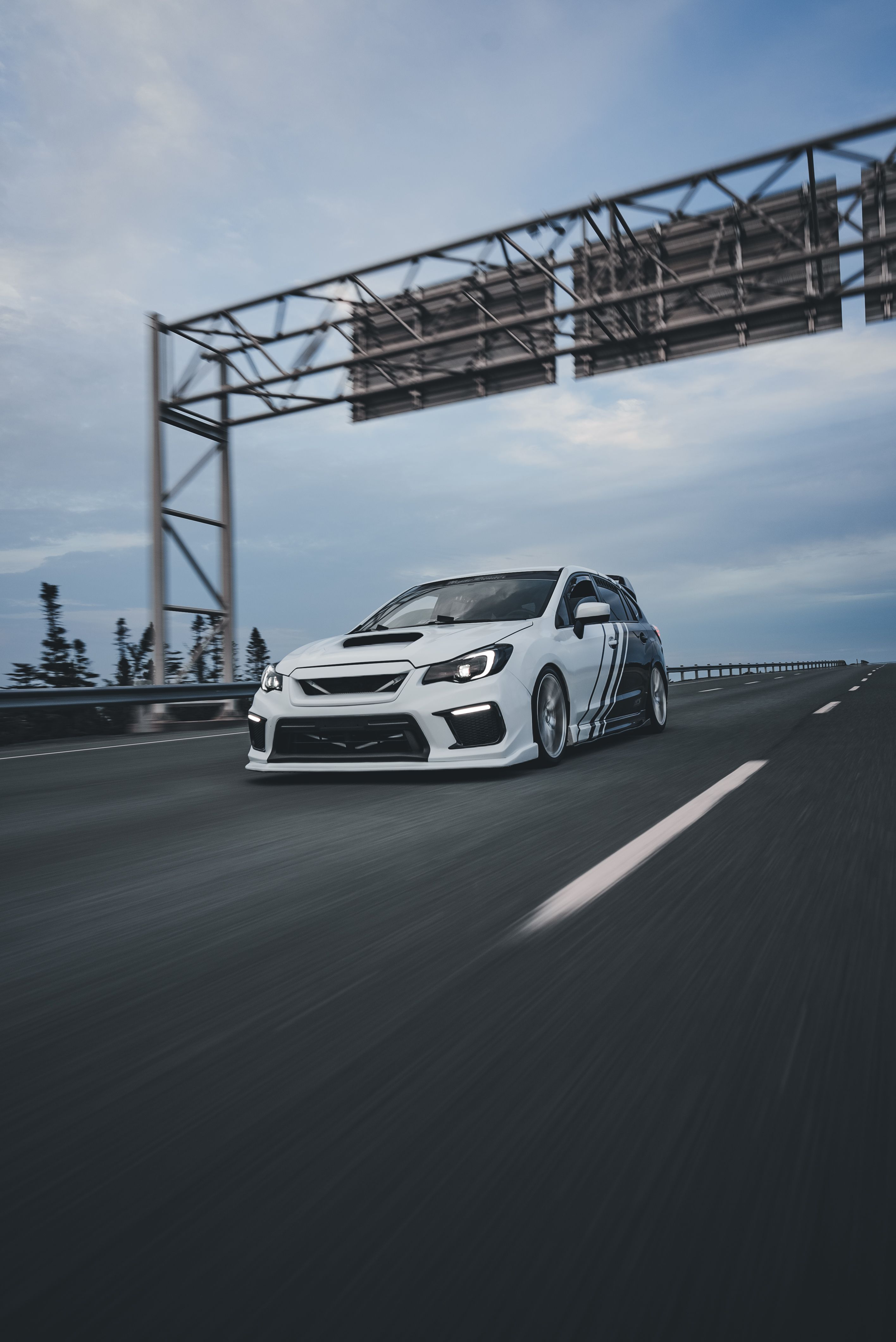 A Subaru WRX Driving Fast on the Street · Free Stock Photo