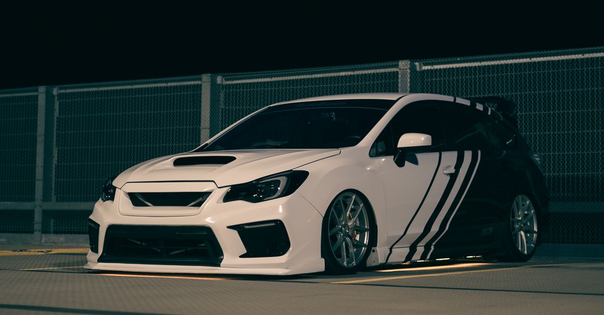 Wrx Modifed A Modified Subaru WRX on a Parking Lot at Night · Free Stock Photo