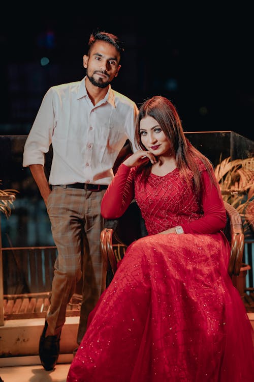 Man in Shirt and Woman in Red Dress