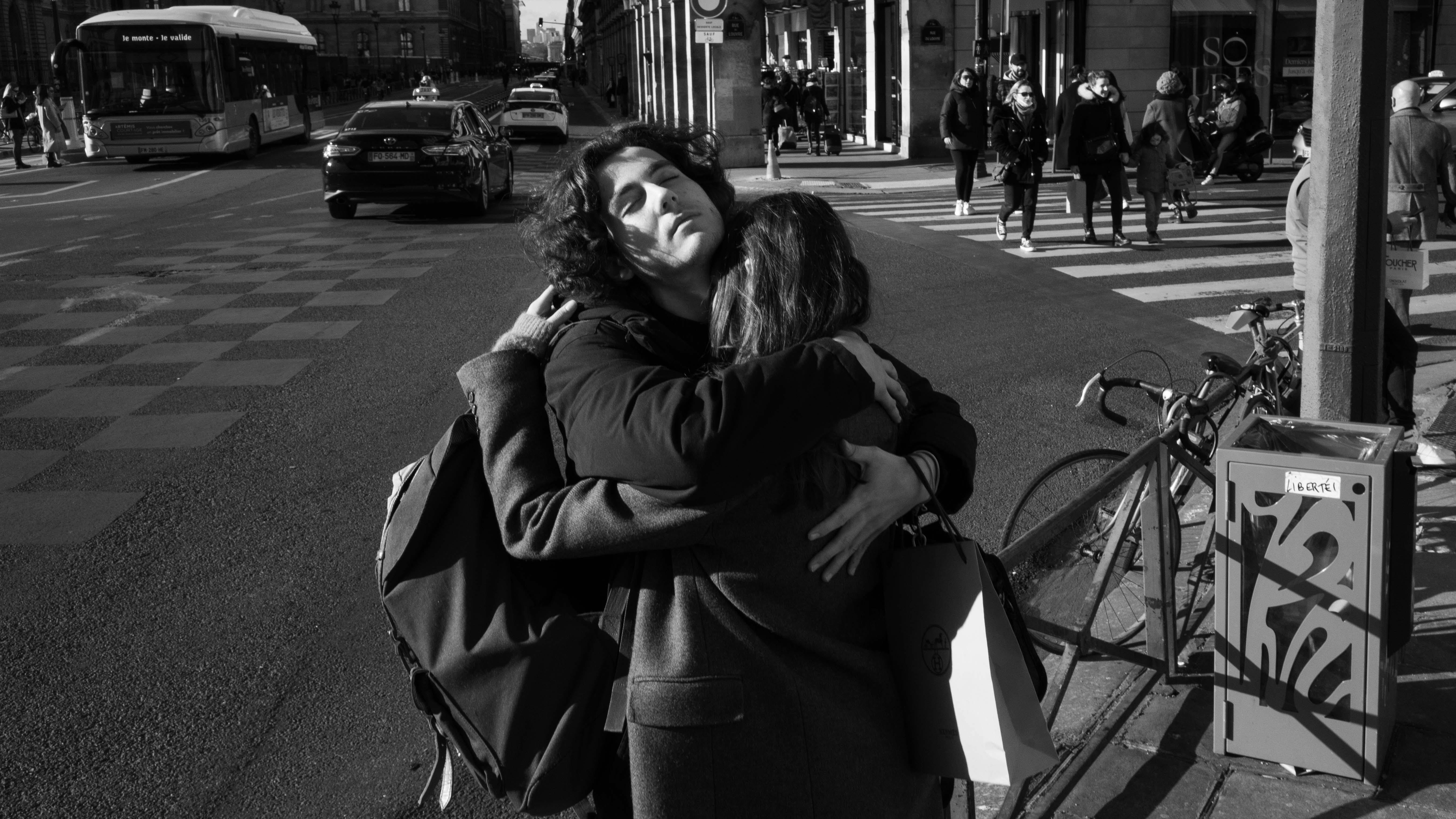 Couple Hugging on Street in Black and White · Free Stock Photo