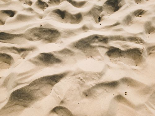Free Close-up view of rippled sand textures at Gold Coast beach, showcasing warm tones. Stock Photo