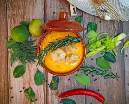 Delicious shrimp stew with herbs and spices in a rustic setting.