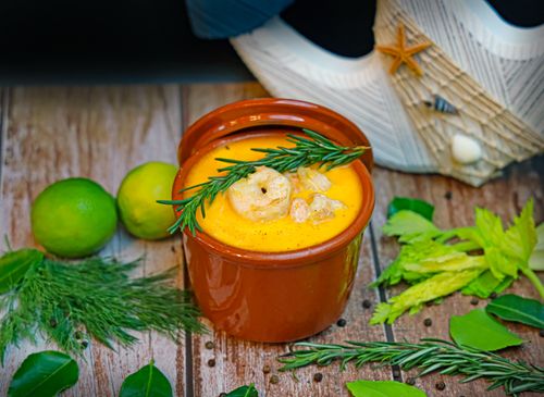 Free A vibrant seafood soup garnished with rosemary and lime, perfect for a cozy meal. Stock Photo