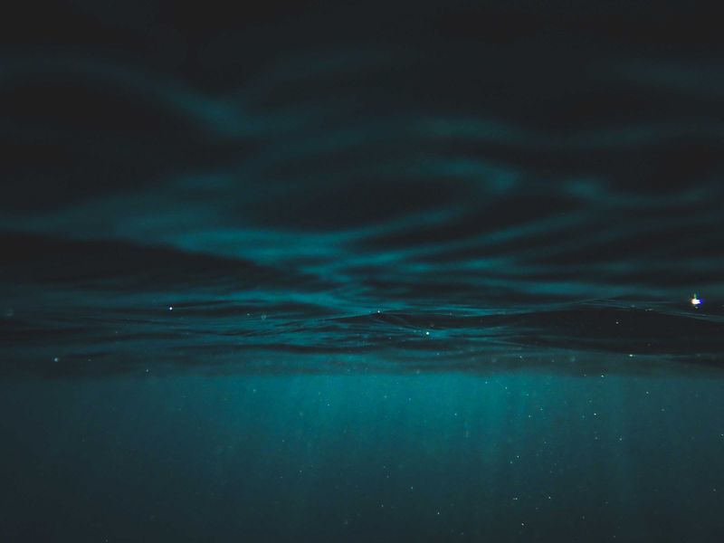 Deep blue-green water below the surface — photo by Francesco Ungaro on Pexels