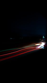 Dynamic long exposure capture of car lights at night in Surat, India showcasing vibrant motion.