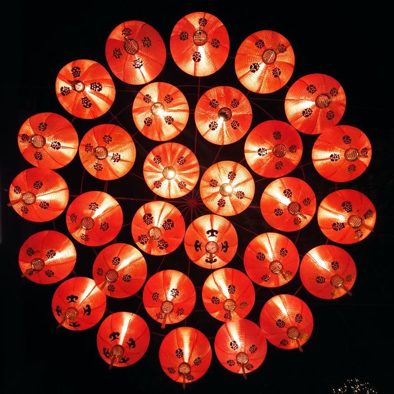 Signal Fires album cover — hanging lanterns at night, photo by JK on Pexels