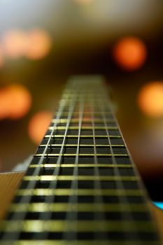 Detailed close-up of guitar strings with soft focus lighting. Ideal for music themes.