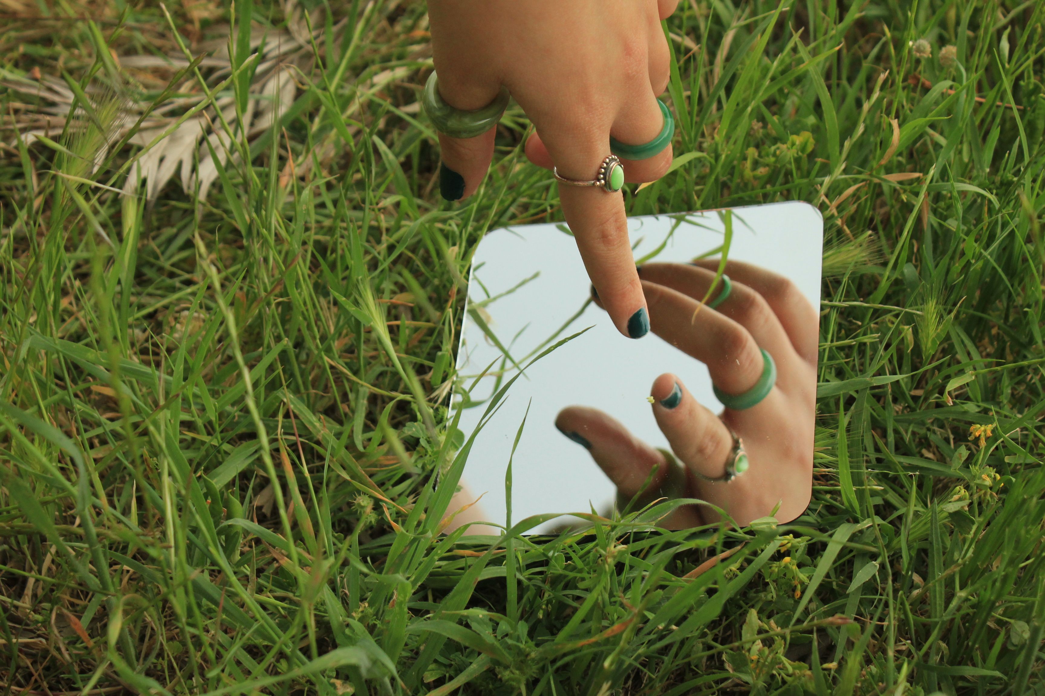 hand-reflecting-in-mirror-free-stock-photo