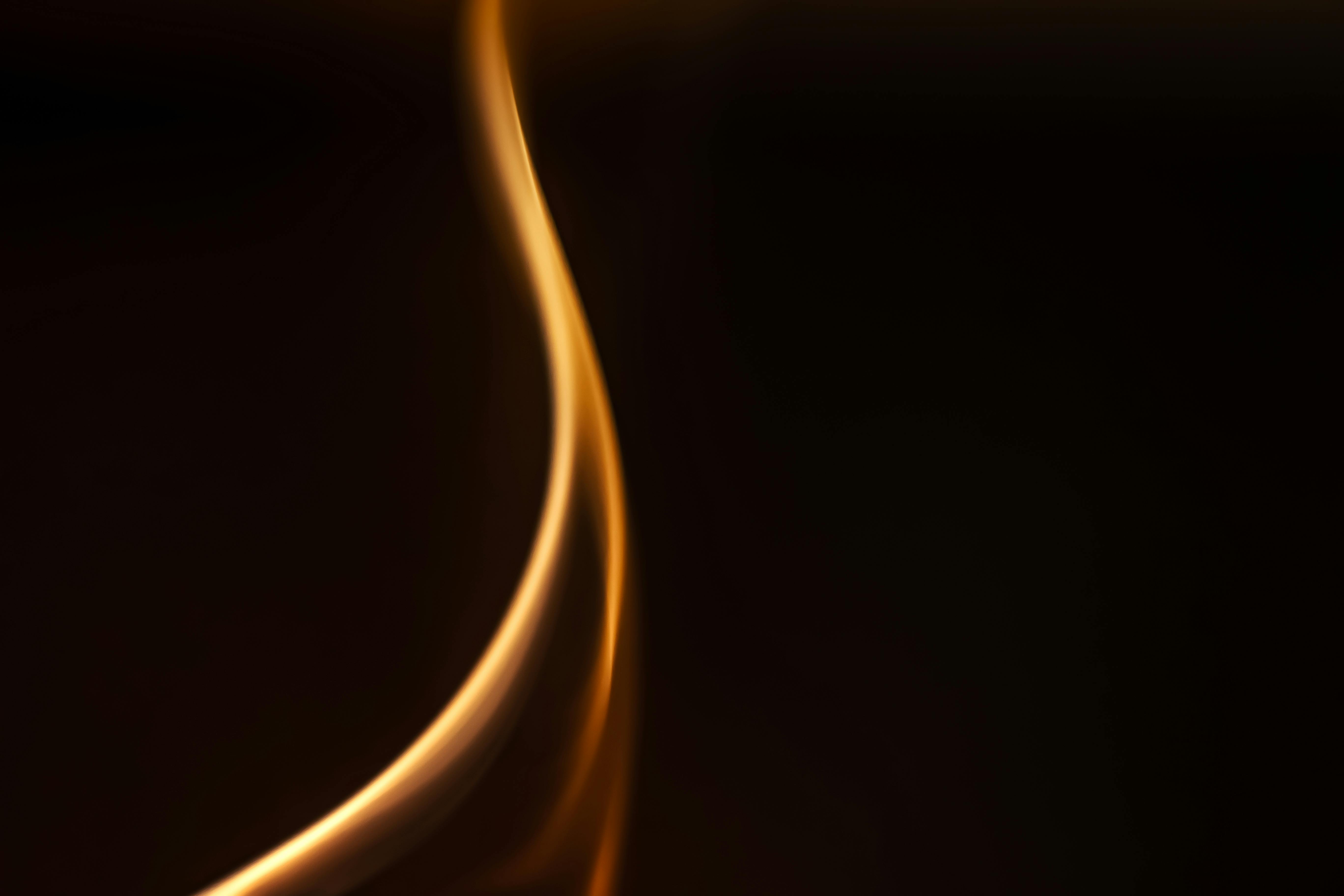 Free Artistic abstract image of a smooth spiral flame against a dark backdrop. Stock Photo