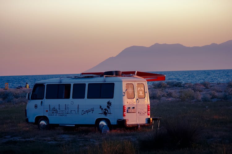 Van On Sea Shore At Sunset 