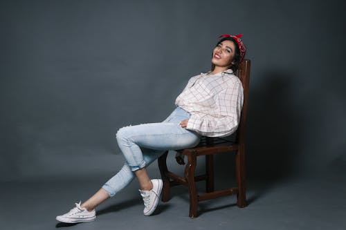 Smiling Woman Sitting on Chair