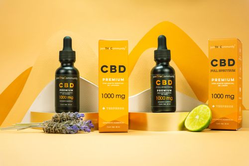 Free Premium CBD oil products with lavender and lime, set against a vibrant yellow backdrop. Perfect for wellness and relaxation themes. Stock Photo
