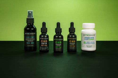 Free A selection of CBD health products set against a vivid green backdrop representing natural wellness. Stock Photo