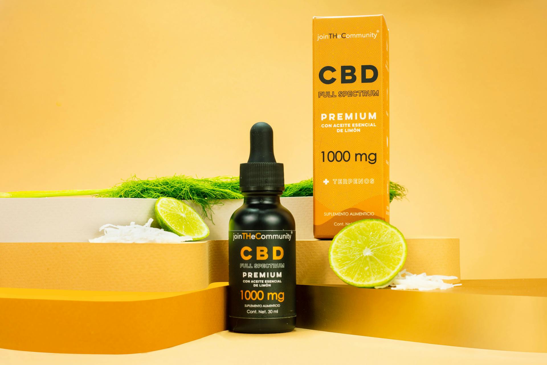 Box and Vial of Cosmetic with Lime Slices around