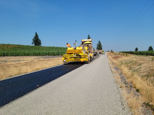 Free Road construction in rural Sublimity, Oregon with heavy machinery on a sunny day. Stock Photo