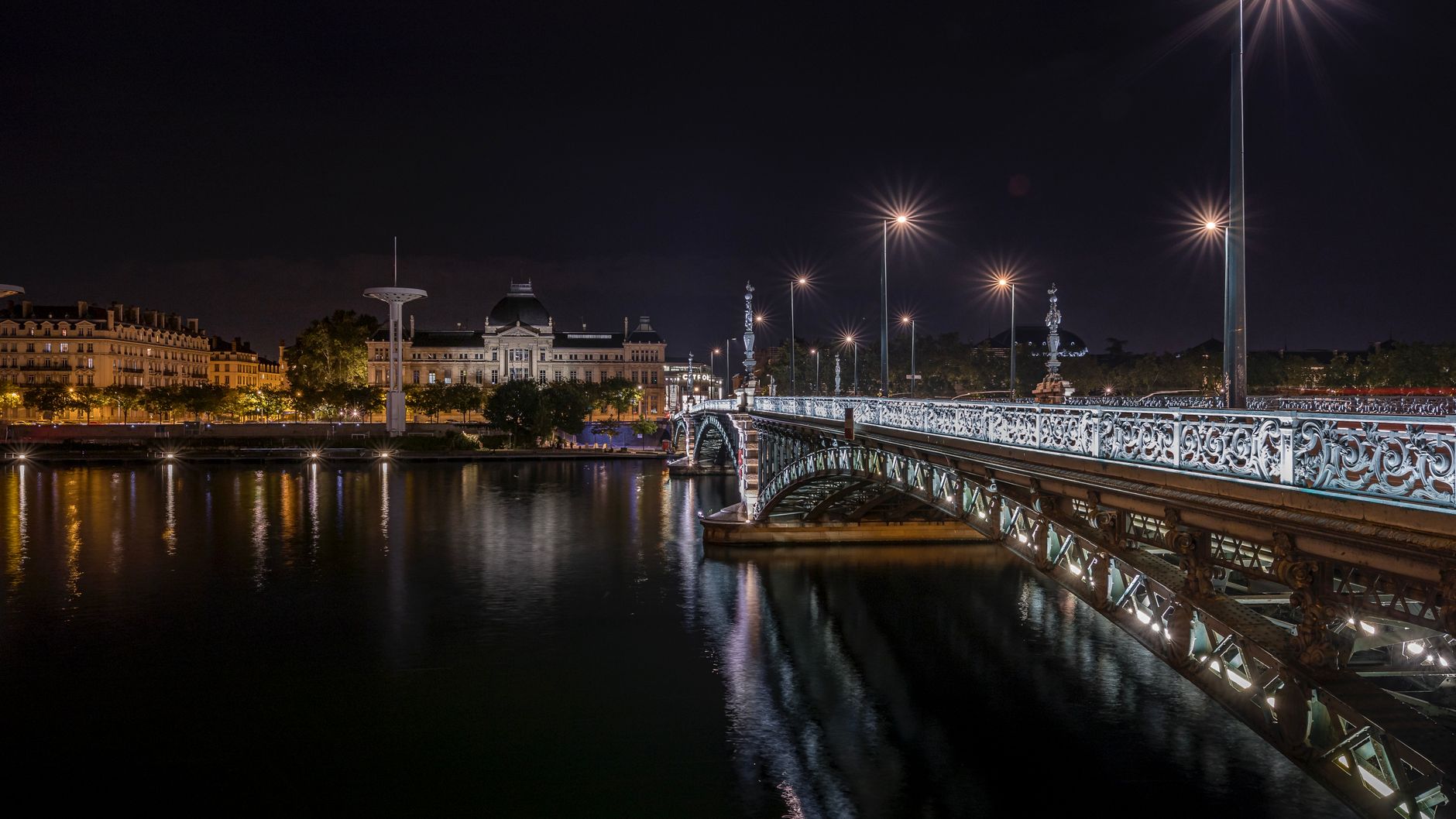 Illuminated University Bridge over the Rhone at night