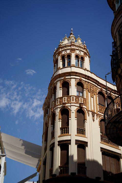 Free A majestic building facade in Seville, Spain, under a clear blue sky. Stock Photo