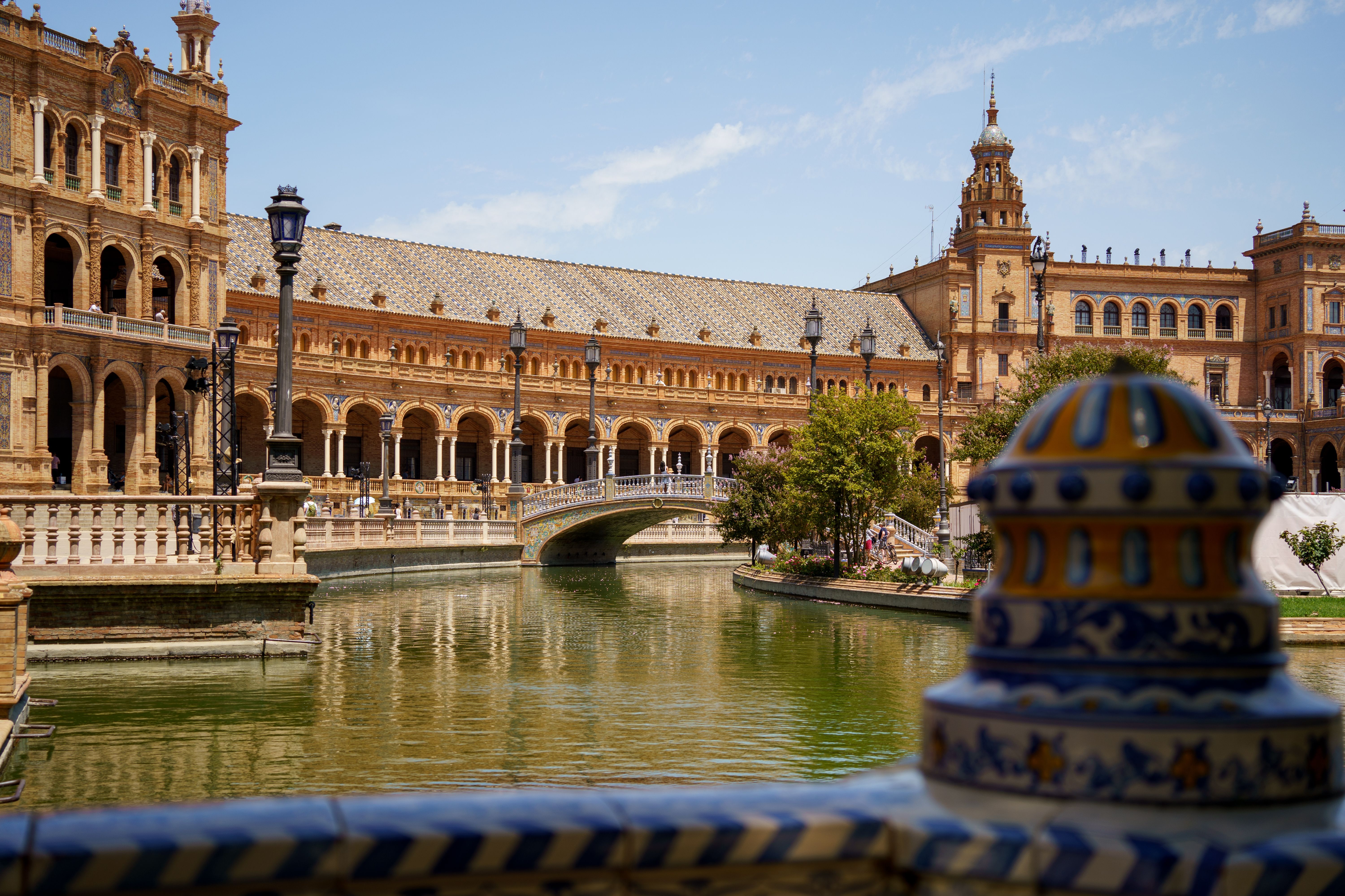 palace and moat at plaza de espana seville spain