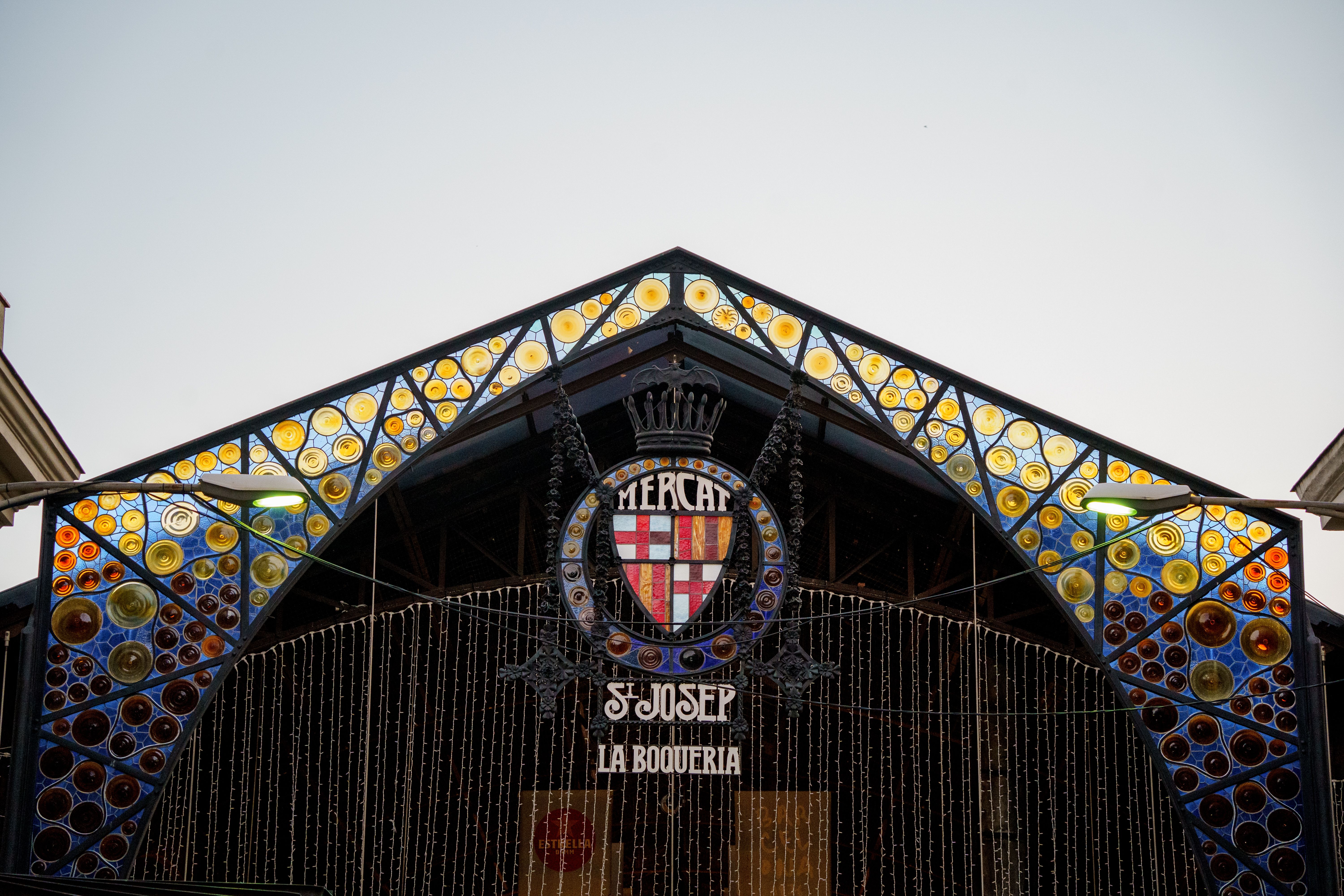 Vibrant facade of Mercat de Sant Josep de la Boqueria in Barcelona, highlighting its colorful design. Vibrant facade of Mercat de Sant Josep de la Boqueria in Barcelona, highlighting its colorful design.