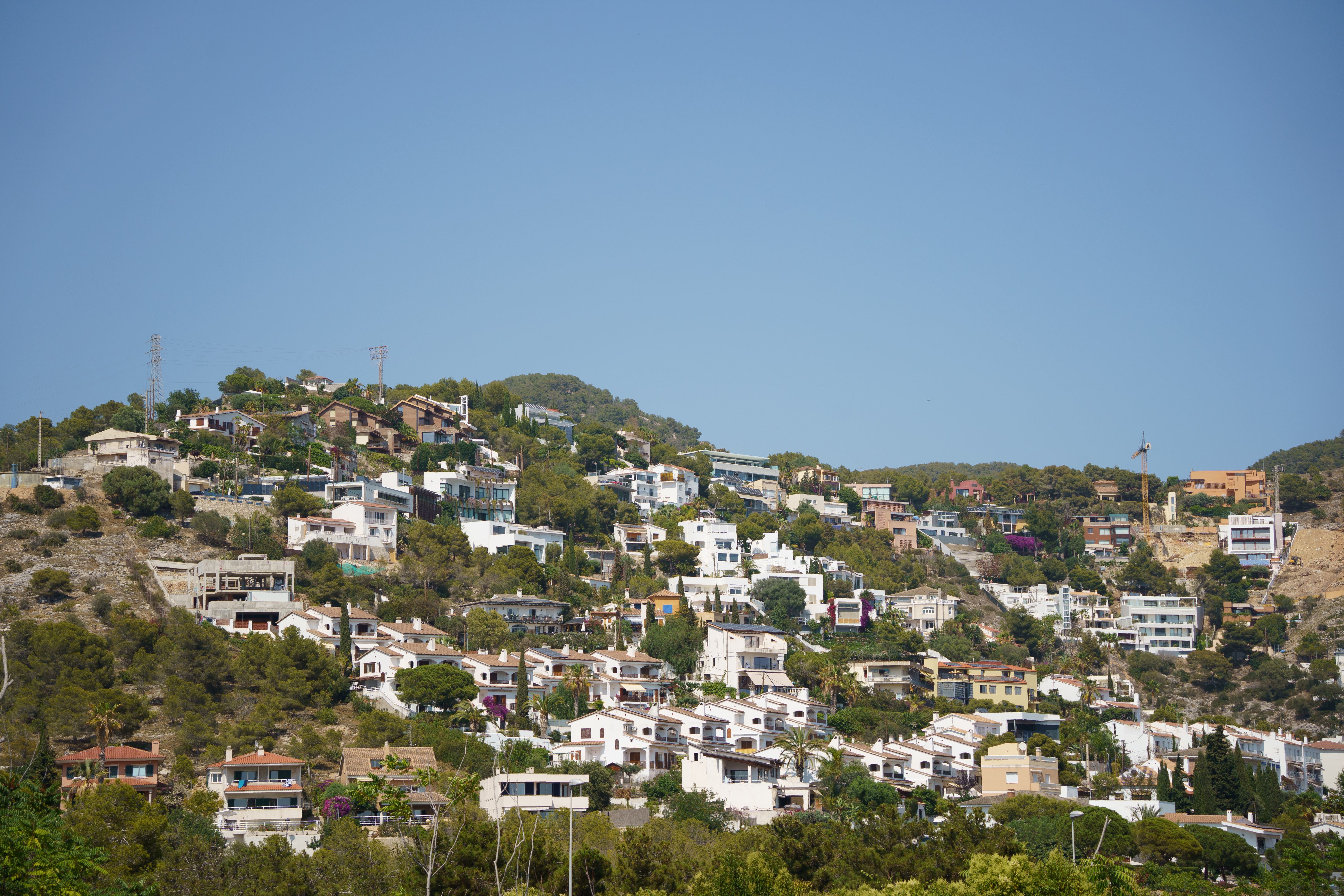 Charming hillside view of residential homes in Sitges, Catalonia, Spain.