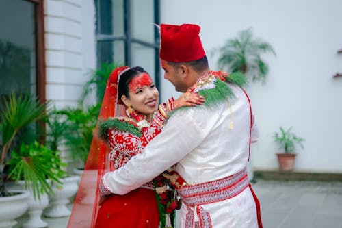 Couple in Traditional Clothing Dancing Together 