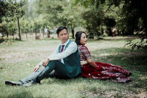 A Couple Sitting in a Park