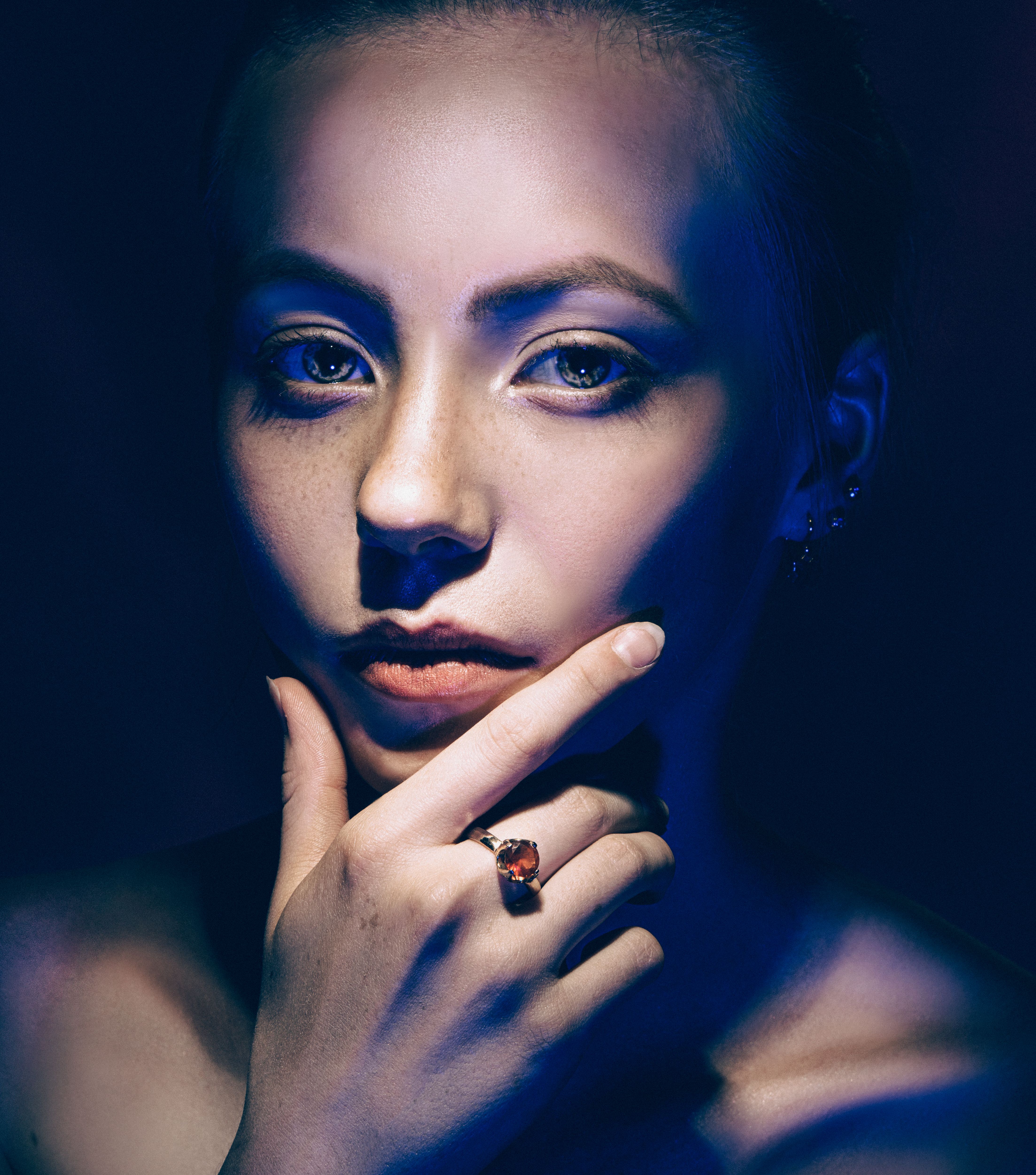A Portrait of a Woman in Blue Light · Free Stock Photo