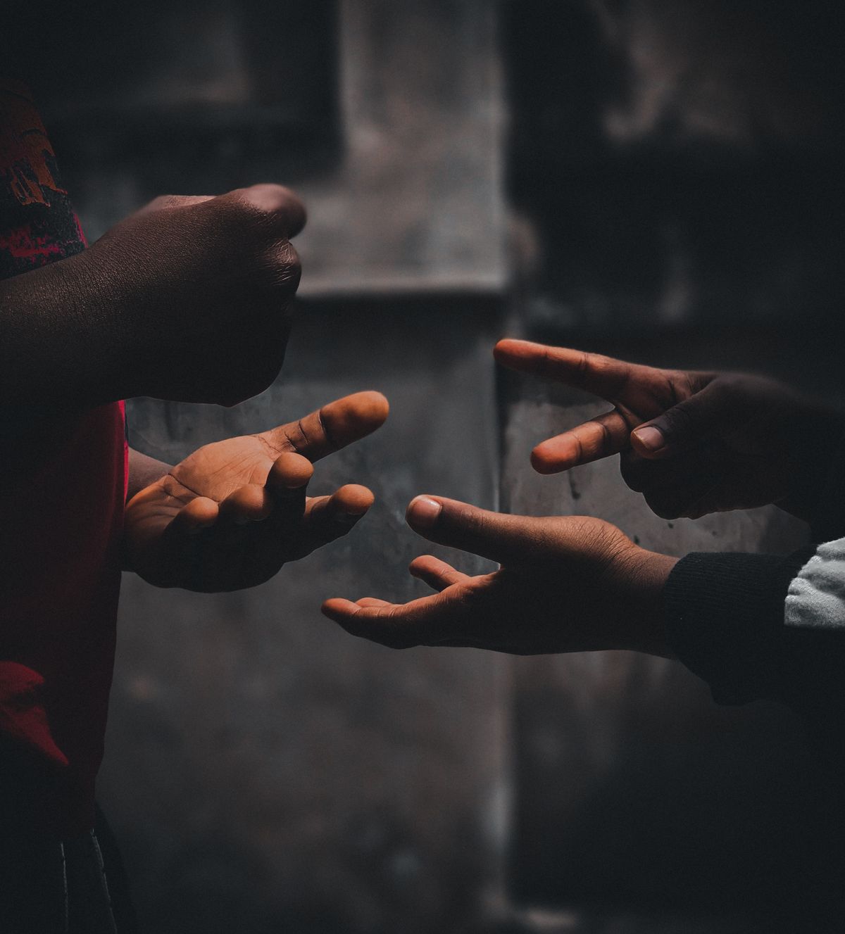 Children playing rock paper scissors with their hands