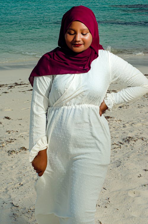 Woman in Hijab Standing on Beach