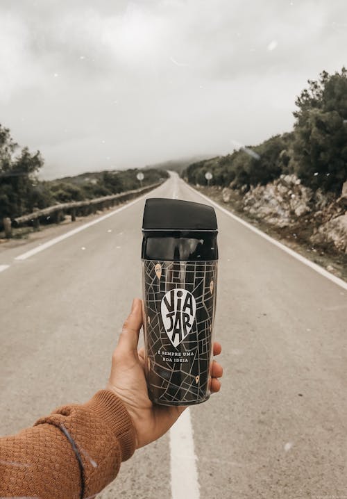 Photo of a Person Holding Tumbler