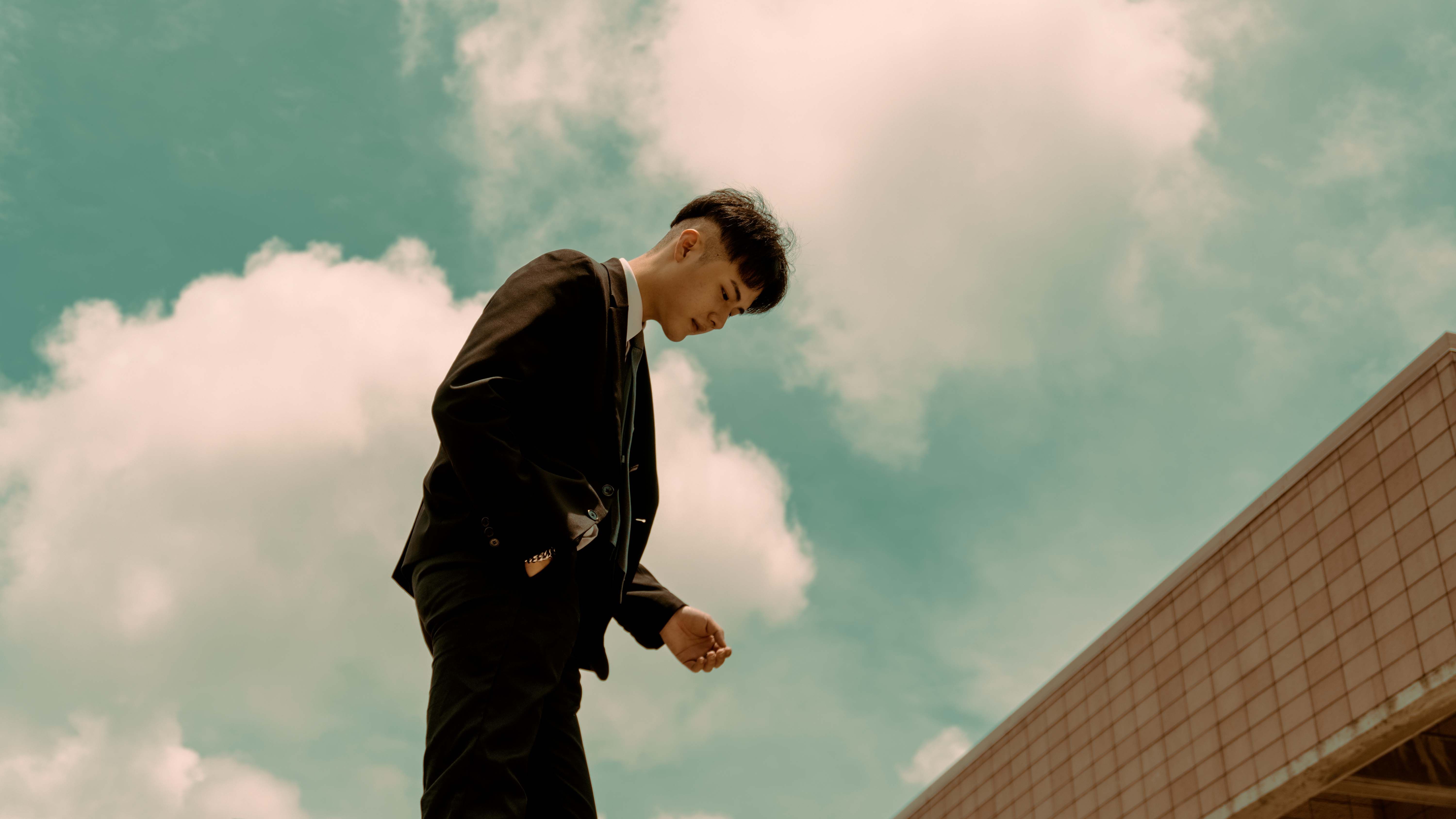Young man in black suit