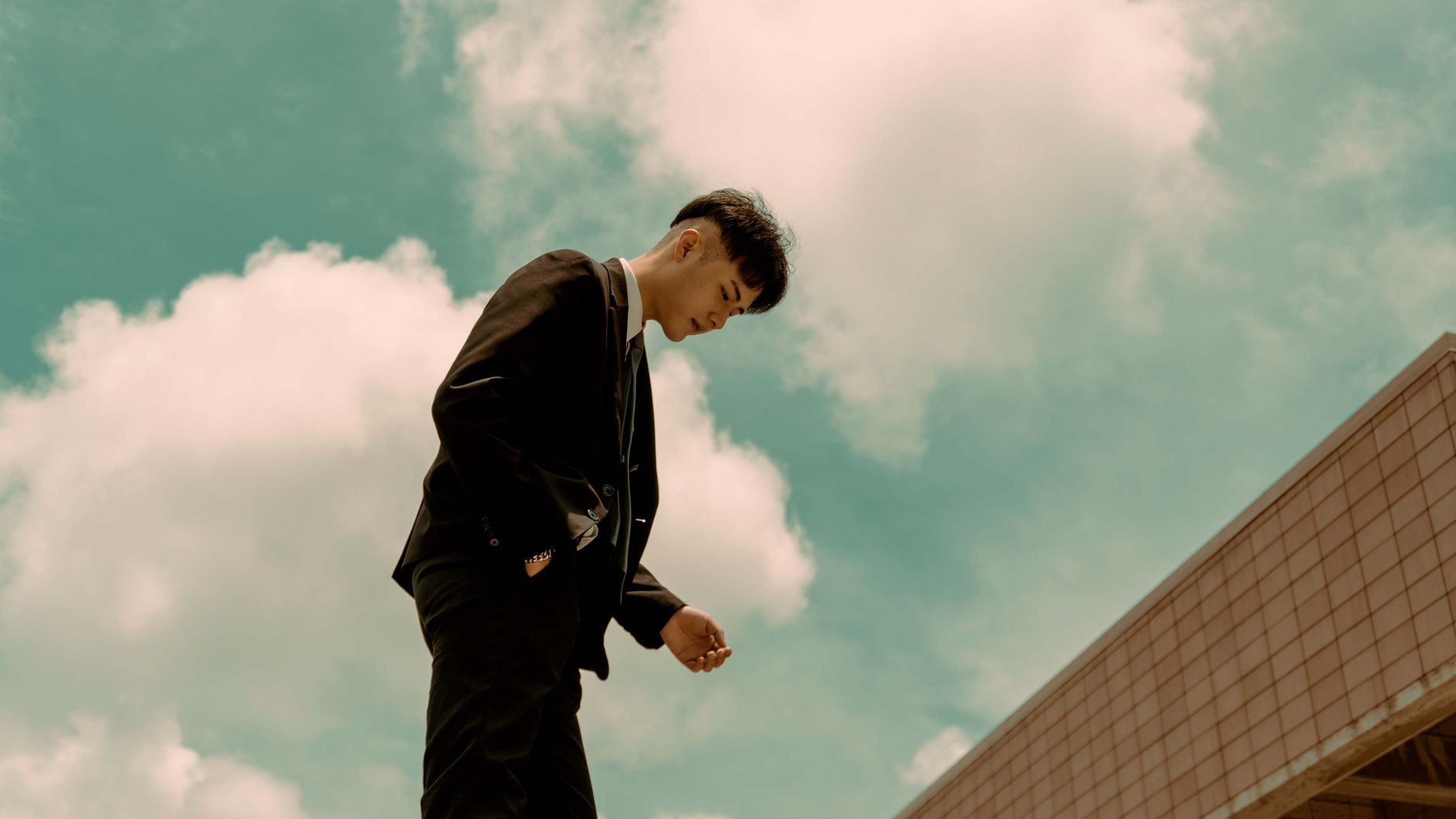 Young man in black suit